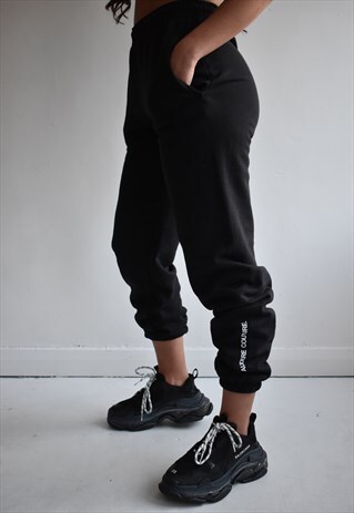BLACK JOGGERS WITH WHITE TEXT LOGO