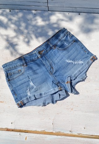 Vintage blue denim mid rise stretch cut off shorts.