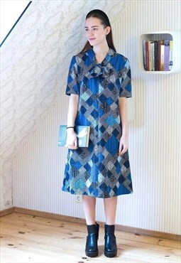 Blue and black patterned dress with bow