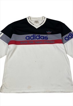 Vintage 90s adidas with the three stipes jersey