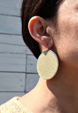 Cream enamel round long earrings .