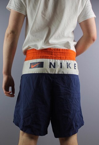 VINTAGE NIKE SHORTS IN NAVY WITH POCKETS, EMBROIDERY, PRINTI