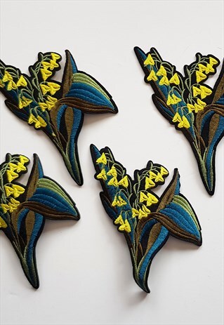 FOUR EMBROIDERED FLORAL IRON-ON TRIMS