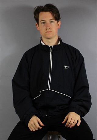 VINTAGE REEBOK WINDBREAKER IN NAVY BLUE WITH POCKETS AND EMB