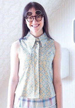 Blue, brown and white sleeveless blouse