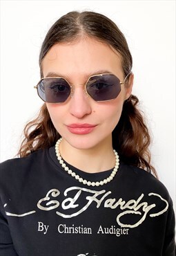 Vintage 00s iconic rave sunglasses in black / gold