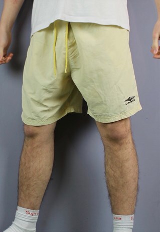 VINTAGE UMBRO SHORTS IN PALE YELLOW WITH POCKETS, DRAWSTRING
