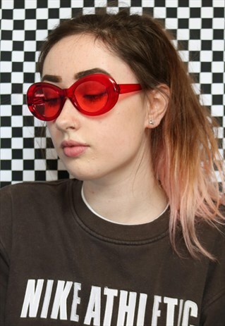DREAMING OVAL SUNGLASSES WITH GLITTER TINTED LENSES IN RED