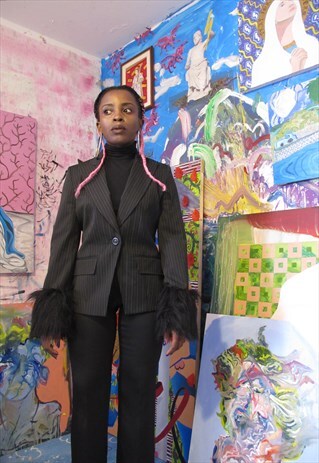 REWORKED BLAZER WITH FAUX FUR CUFFS.