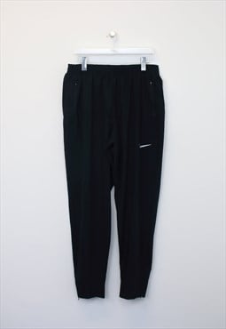 Vintage Nike track pants in black. Best fits XL