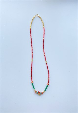 BEADED NECKLACE WITH GOLD PLATED BIRD CHARM