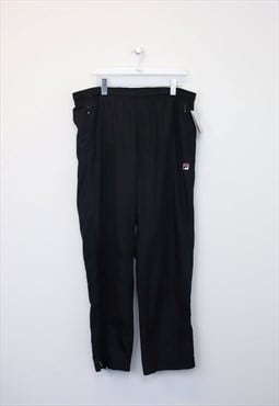 Vintage Fila track pants in black. Best fits L