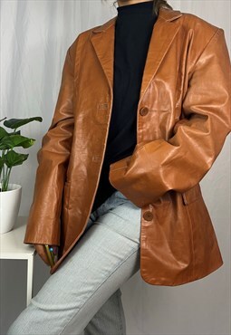 Vintage Y2K leather coat in orange. 