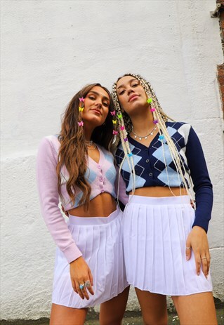 THE PLEATED TENNIS SKORT IN WHITE