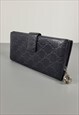GUCCI vintage black leather GG monogram wallet with a charm.