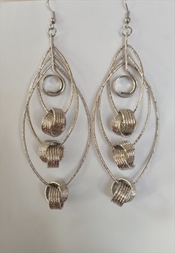 Silver tone layered statement earrings