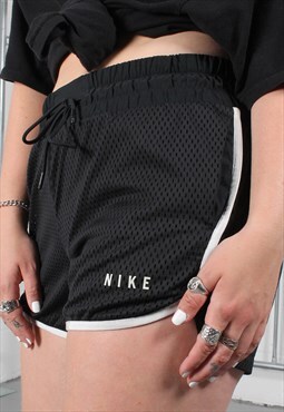 Vintage Nike Shorts in Black with Spell Out Logo Medium