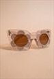 DAISY : CLEAR PERSPEX SUNGLASSES WITH FLOWER EYE FRAME BROWN