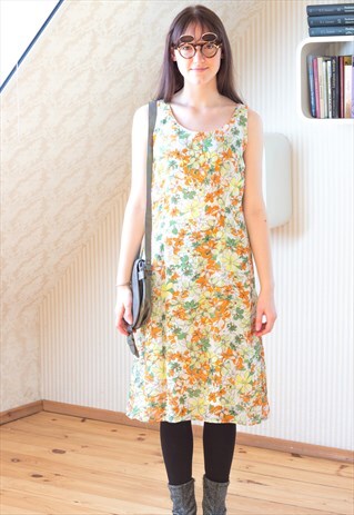 WHITE DRES WITH GREEN YELOW AND ORANGE FLOWERS