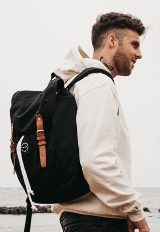 'BRAVE FREE WILD AS THE SEA' RUCKSACK BACKPACK IN BLACK
