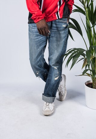 VINTAGE LEVI'S 501 JEANS IN BLUE WITH RIPS AND PAINT MARKS