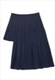 Vintage pleated asymmetric skirt in navy blue. Raw cut hemli