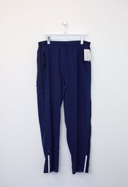 Vintage Starter track pants in blue. Best fits XL