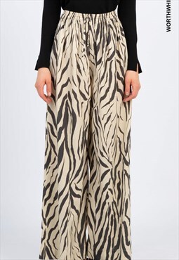 Zebra printed pants, with front fastening with cord