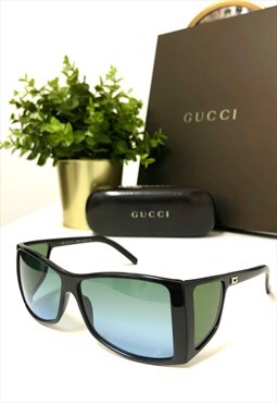 Gucci GG 2466/S Retro wrap around Side-Lens sunglasses. 