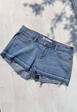 Vintage blue denim low waist stretch cut off shorts.