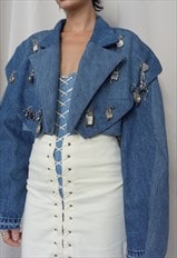 Dawn. Denim jacket embellished with watches