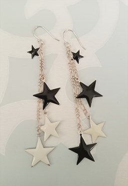 Black and white dual colour enamel star dangle earrings.