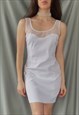 Vintage 90s mini dress in white with plastic decolletage