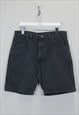 Vintage Wrangler denim shorts in black. Best fits W36