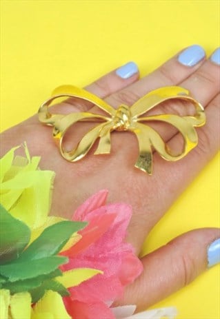 1990S BOW BROOCH, GOLDTONE METAL RIBBON PIN