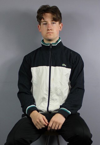 VINTAGE LACOSTE WINDBREAKER JACKET IN WHITE AND NAVY BLUE WI