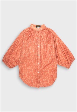 Orange shirt with floral print