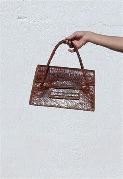 Vintage genuine snake leather brown handle bag.