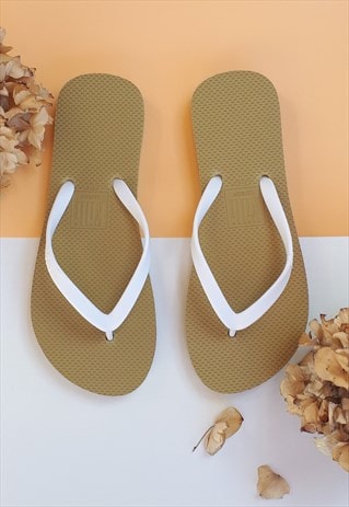 NAKED TWO TONE GOLD FLIP FLOPS WITH WHITE STRAPS