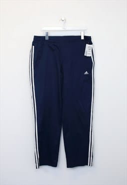 Vintage Adidas track pants in blue. Best fits L