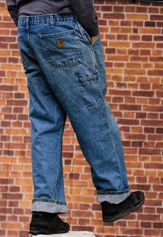 VINTAGE 90'S CARHARTT ORIGINAL FIT JEANS IN A DENIM BLUE
