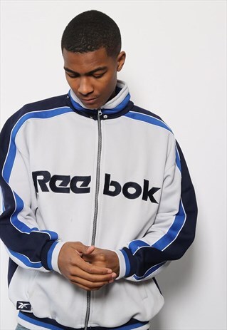 VINTAGE REEBOK SPELLOUT TRACK JACKET WHITE AND BLUE