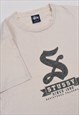 VINTAGE 90S STUSSY SPELLOUT LOGO T-SHIRT IN BEIGE