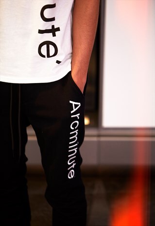 BLACK TRACKSUIT BOTTOMS WITH ARCMINUTE LOGO