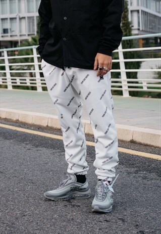 JOGGER TROUSERS IN BEIGE WITH YOUR EGO SUCKS PRINT