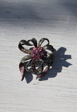 Vintage bronze brooch with pink glass crystals.