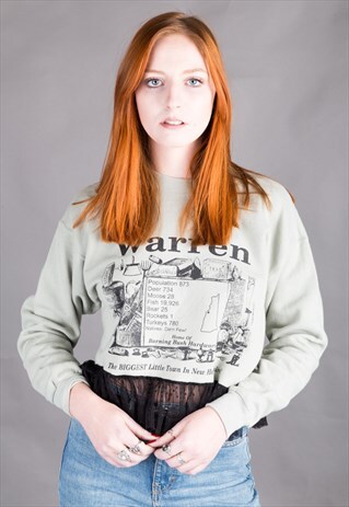 REWORKED VINTAGE CROP SWEATER WITH TASSEL PEPLUM.