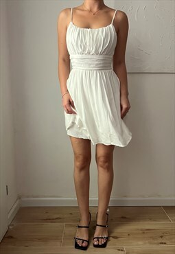 Vintage mini summer pleated dress with flowing white fabric 