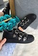 BLACK FAUX LEATHER BUCKLED PUMPS / TRAINERS