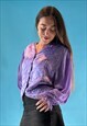 VINTAGE 1970S PURPLE TEXTURED BLOUSE WITH BALLOON SLEEVES.